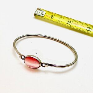 A cats eye bangle set in a branded 925 sterling silver, vintage